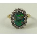 An 18ct gold, opal and diamond ring,