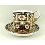 A Royal Crown Derby Imari pattern moustache cup and saucer, both marked to base 2451,