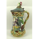 A Minton Majolica Jester tower jug, with moulded dancing figures,
