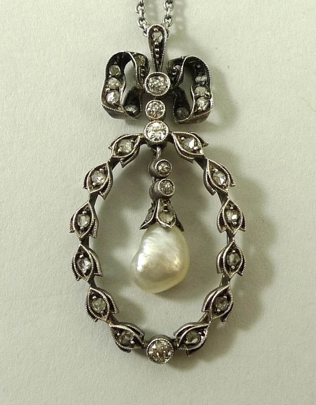 A Victorian baroque pearl and diamond set trembleuse pendant necklace, on a silver chain, 44cm,