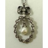 A Victorian baroque pearl and diamond set trembleuse pendant necklace, on a silver chain, 44cm,