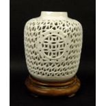 A modern Chinese reticulated porcelain blanc de chine vase, of ovoid form, 12 by 14cm,