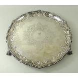 A silver salver, with cast bead and leaf rim, the reserve with a griffin, on ball and claw feet,