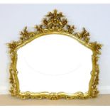 A modern Victorian style gilt overmantle mirror, with domed top, carved crest,