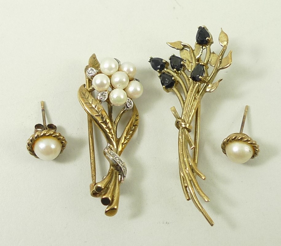 A diamond, pearl and gold floral spray brooch, an amethyst and gold spray brooch,