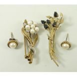 A diamond, pearl and gold floral spray brooch, an amethyst and gold spray brooch,