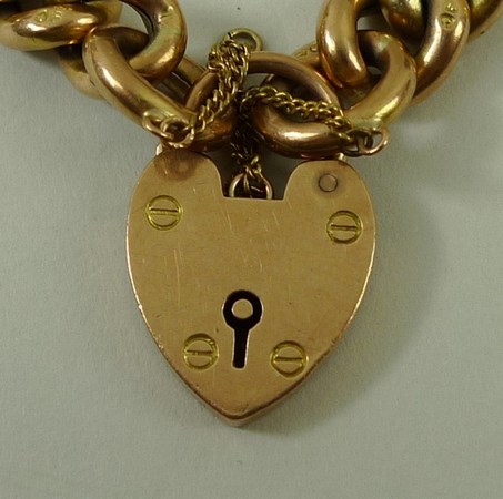 A 9ct gold link bracelet with pad lock clasp and safety chain, 20.2g. - Image 2 of 4