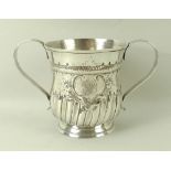 A George III silver porringer two handled cup, the baluster body decorated with a rope twist girdle,