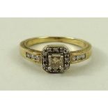 A 9ct gold and diamond ring, the central princess cut diamond approximately 0.