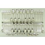 A set of George III silver flatware, in the, Old English pattern, comprising twelve table spoons,