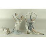 A group of Nao figurines depicting ballet dancers, comprising a girl lying down, 23 by 9cm,