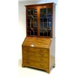 A George III style mahogany bureau bookcase, circa 1880,