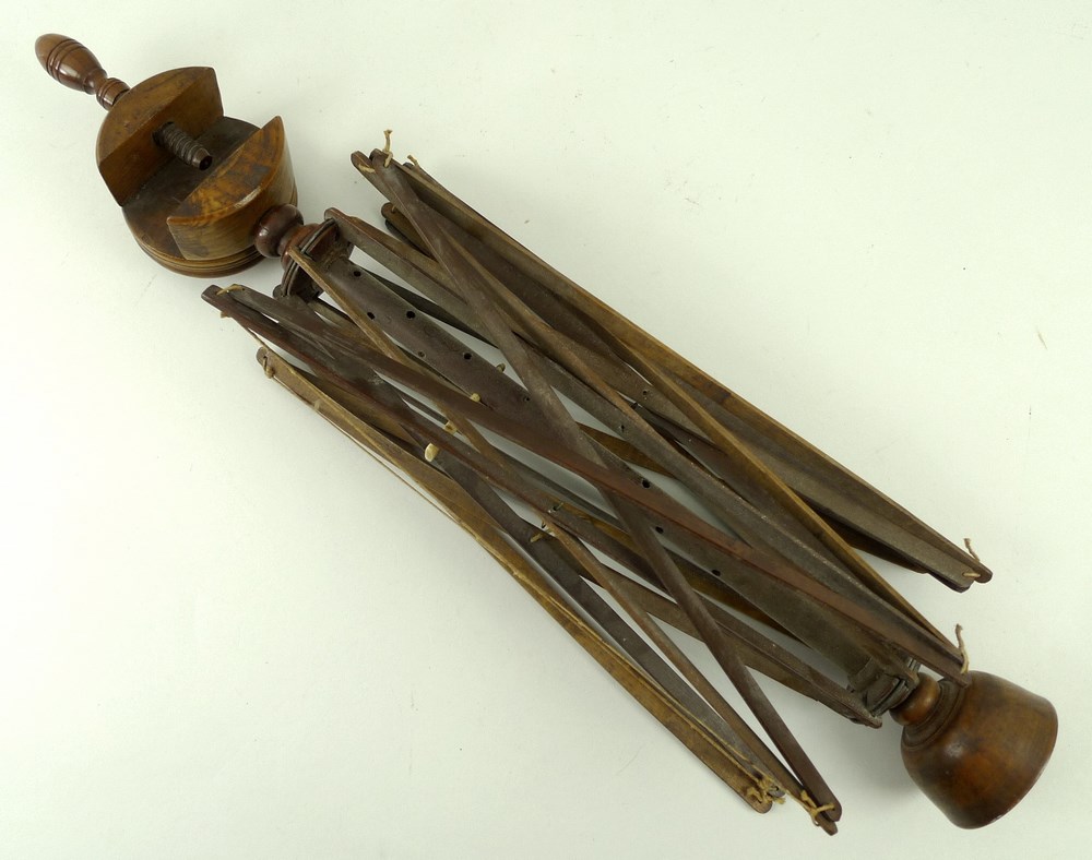 A Victorian turned beechwood wool spinner or yarn winder, with turned cup end and clamp attachment,
