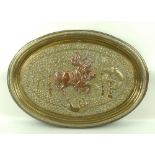 A Persian copper and brass embossed tray or plaque, 19th century, of oval form,