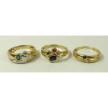 A group of three 18ct gold dress rings, of modern design, one set with a sapphire, diamond,