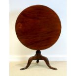 A George IV mahogany tripod table, circa 1825,