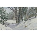 A winter woodland path with snow, watercolour, signed lower right 'Andrew Gamely',