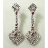 A pair of drop earrings, set with diamonds and four rubies,