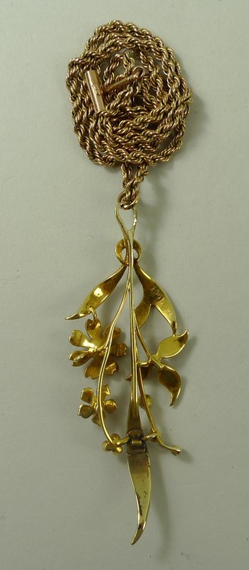 A 15ct gold and seed pearl pendant, formed as a floral corsage of three flowers amongst leaves, 5. - Image 3 of 4