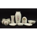 A collection of Belleek ceramics decorated with printed lily design, country trellis pattern,