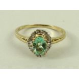 A 14ct gold, emerald and diamond ring,