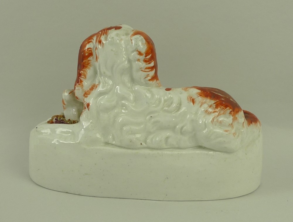 A 19th century Staffordshire model of a King Charles spaniel with two puppies, 12 by 6 by 8cm. - Image 2 of 3