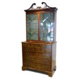 A George III mahogany secretaire cabinet, circa 1775,