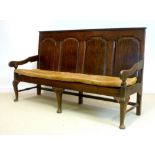 A mid 18th century provincial oak settle,