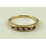 A 9ct gold, ruby and diamond ring, set with five rubies divided by four diamonds, size S, 2.2g.