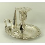 A George III silver chamber stick with a foliate cast sconce, on a scrolled,