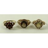 A 9ct gold and smoky quartz ring, the solitaire oval stone in an open setting, size L, 3.