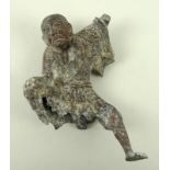 A Chinese cast metal figure of a sage wearing a feathered surcoat,