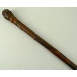 A Japanese bamboo sword stick, the stick carved with female figures, 82cm.