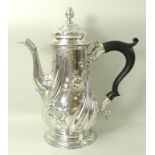 A George III silver coffee pot, Huguenot interest, of baluster form with spiral fluting,