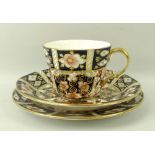 A Royal Crown Derby part teaset, decorated in gilt-heightened Imari palate, comprising six tea cups,