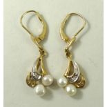 A pair of 18ct bi-coloured gold, diamond and cultured pearl drop earrings. Note: pearls untested.