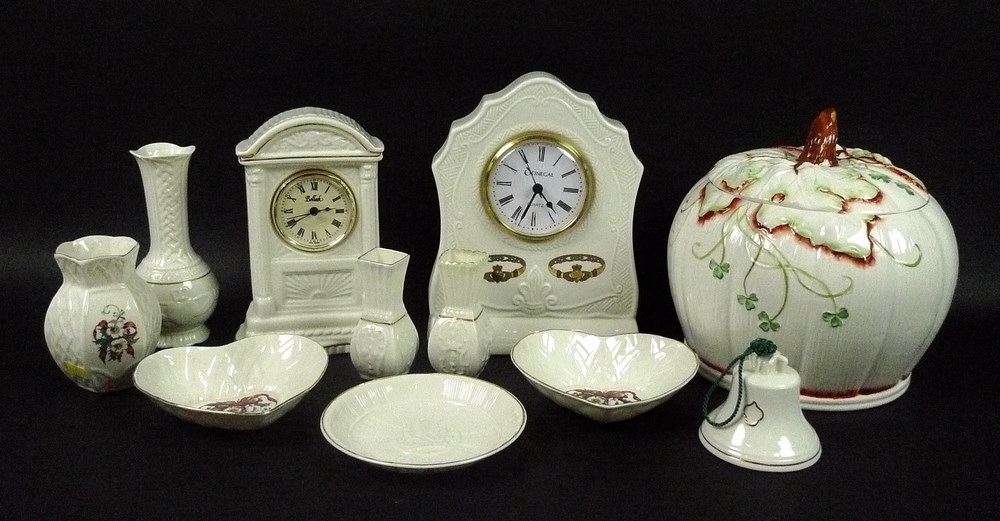 A collection of Belleek ceramics comprising Donegal clock, 23cm, vine clock, 20cm,