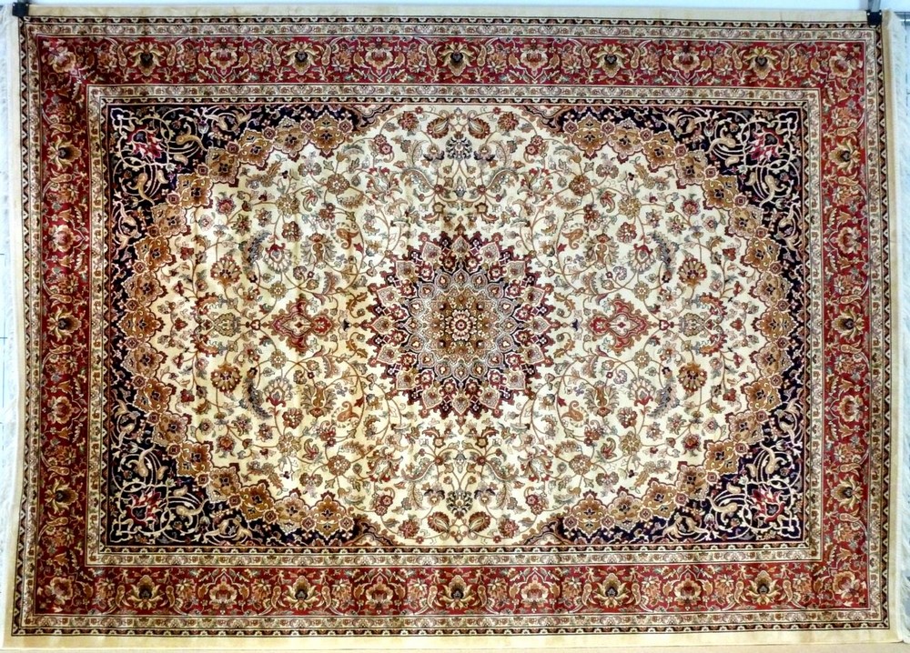 A Keshan rug with beige ground, central star medallion,