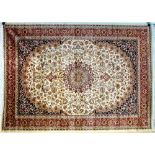 A Keshan rug with beige ground, central star medallion,