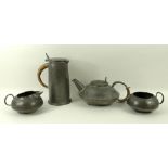 A Liberty pewter four piece tea set, after a design by Archibald Knox, comprising a tea pot,