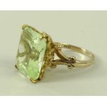 A 14ct gold and pale green tourmaline dress ring, with a single emerald cut tourmaline, 16 by 14mm,