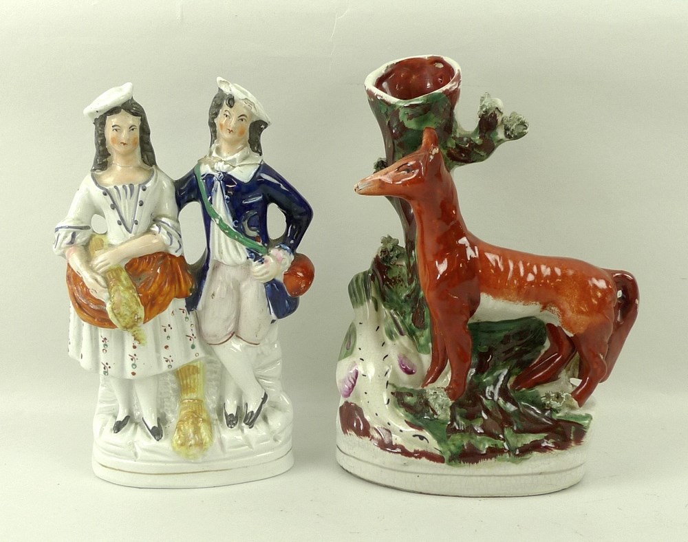 A Staffordshire spill vase, moulded with a fox by a stump, 21cm,