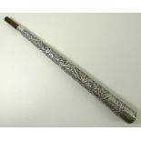 An Indian silver metal parasol handle, deeply engraved with forest animals, 34cm.