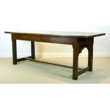 An early 18th century oak refectory table,