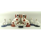 A group of four similar Staffordshire figures of seated Dalmations, 14cm,