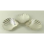 A set of three George II silver shell dishes,