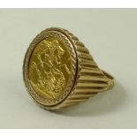 A George V sovereign, 1914, set in 9ct gold ring, with reeded sides, approximately 14.9g.