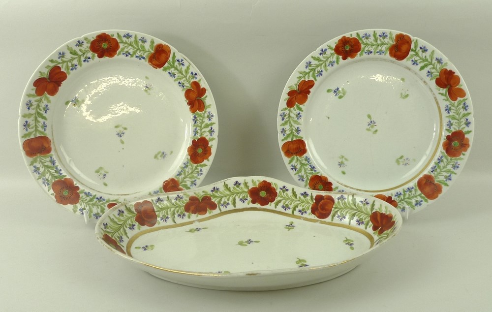 A pair of English creamware dessert plates, early 19th century, 21cm, and an oval dish, 28 by 19cm,