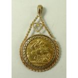 A George V sovereign, 1918, set in gold rope twist pendant setting with heart,