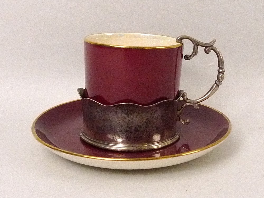 A Crown Devon Fielding's part coffee set, in maroon ground, the cups in silver holders,